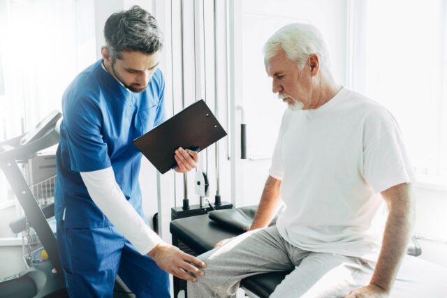 Sport Doctor diagnosing patient Arthritis and Joint Pain 